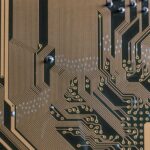 gold circuit board in close up photography